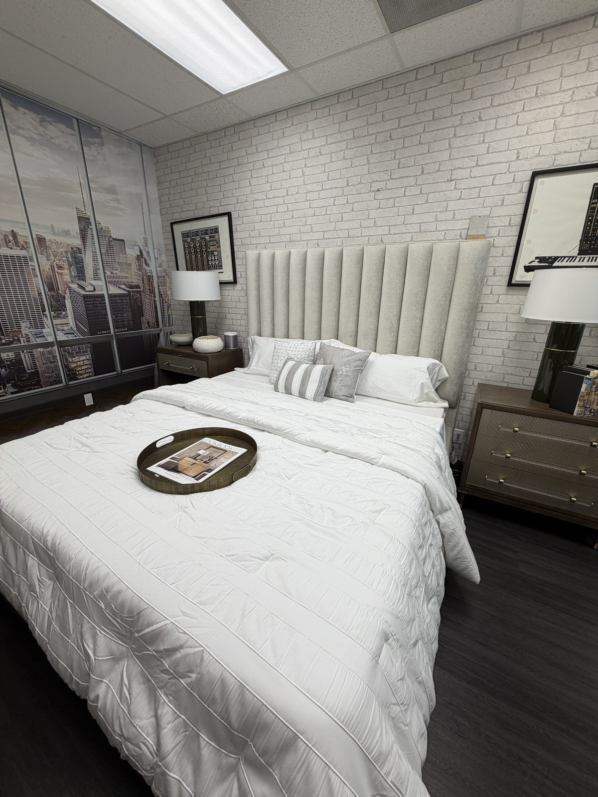 Vanguard channel-tufted upholstered headboard with reeded wood nightstands and acrylic-pull dressers — a Vanguard bedroom vignette at Haptor Barrett Los Angeles